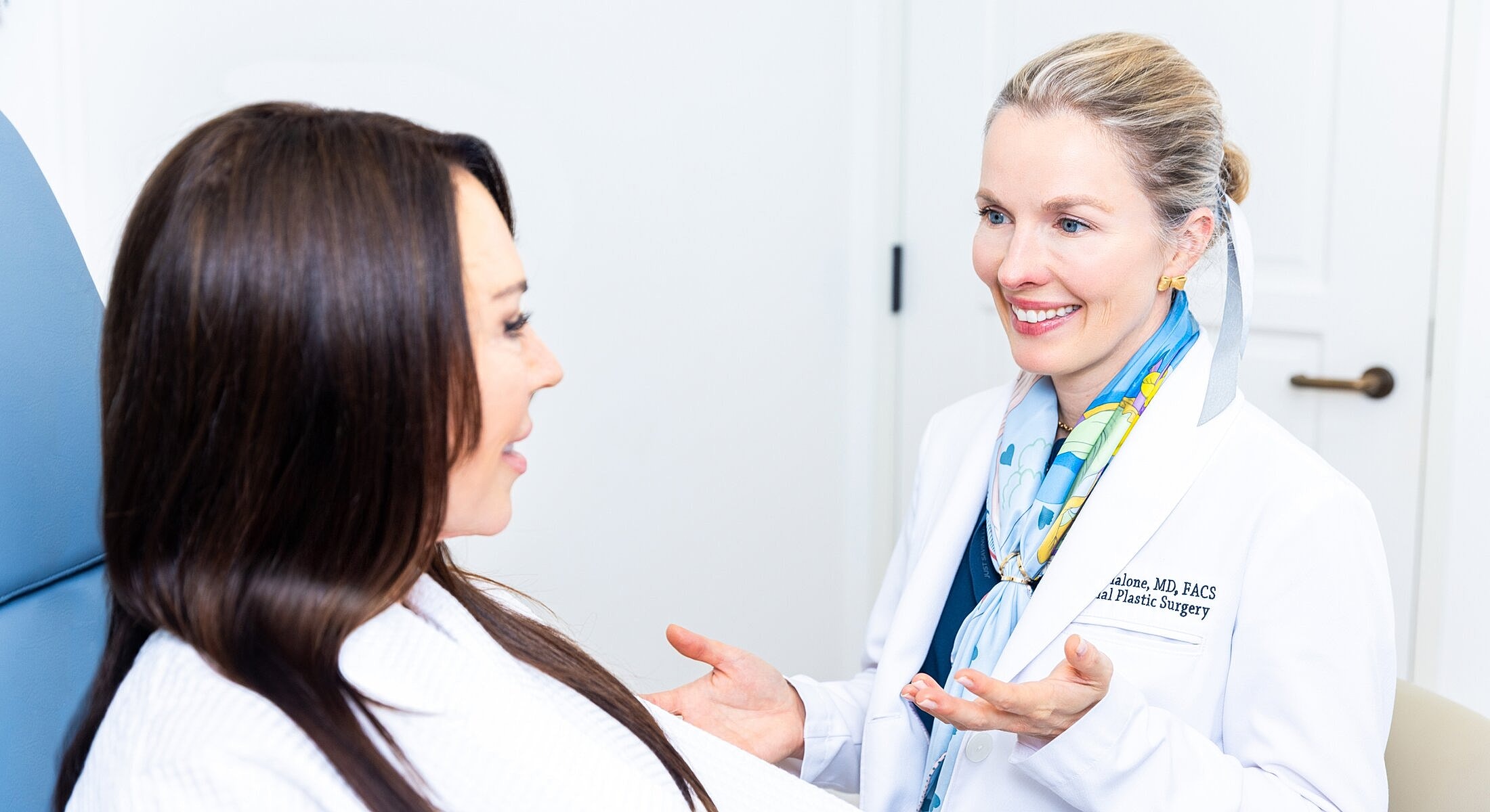 Doctor consulting with patient in office setting.